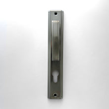 Load image into Gallery viewer, A silver-colored cylindrical door lock, vertical in orientation, with a keyhole visible on the locking side.
