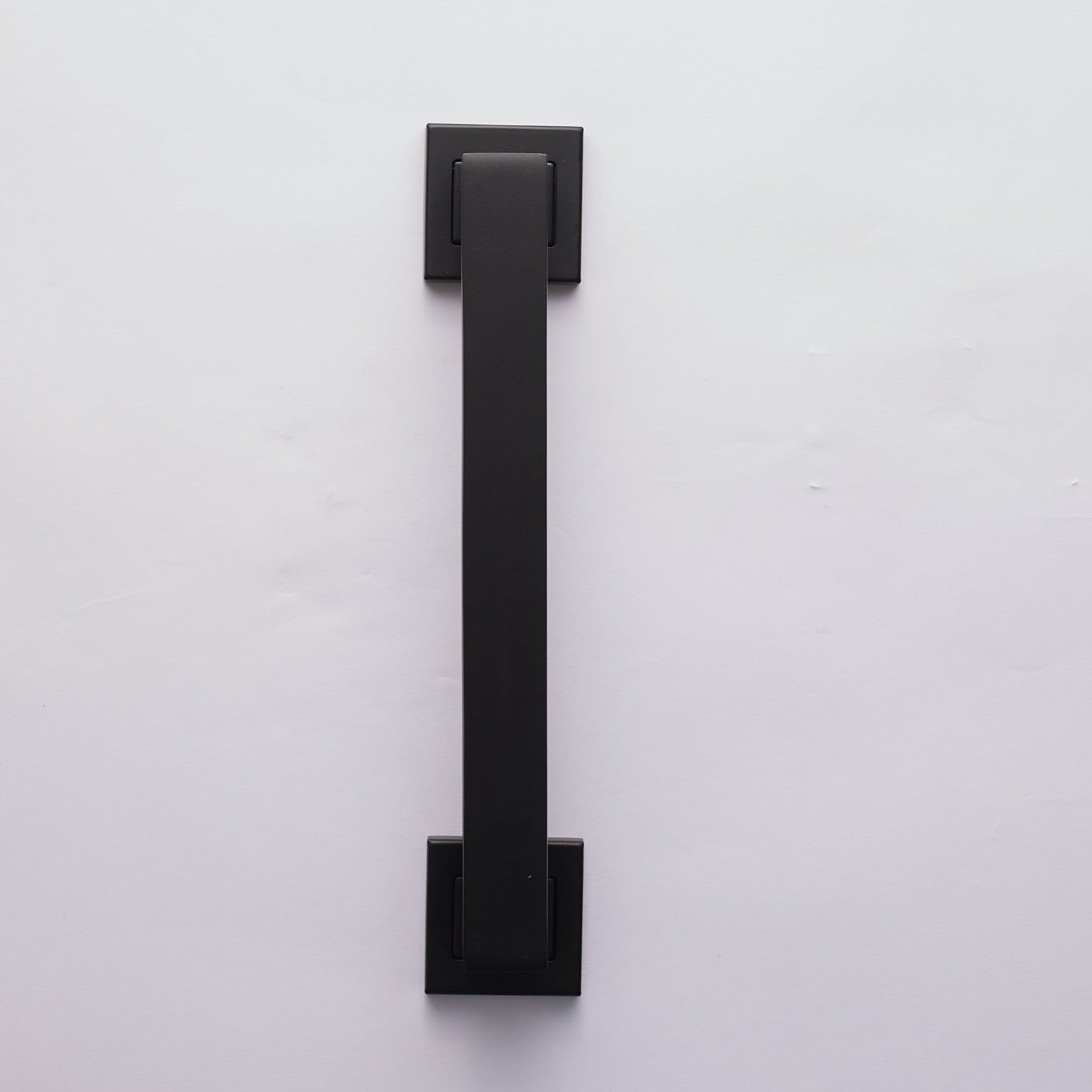 A black door pull handle with an aluminum and zinc alloy construction, presented against a white background.