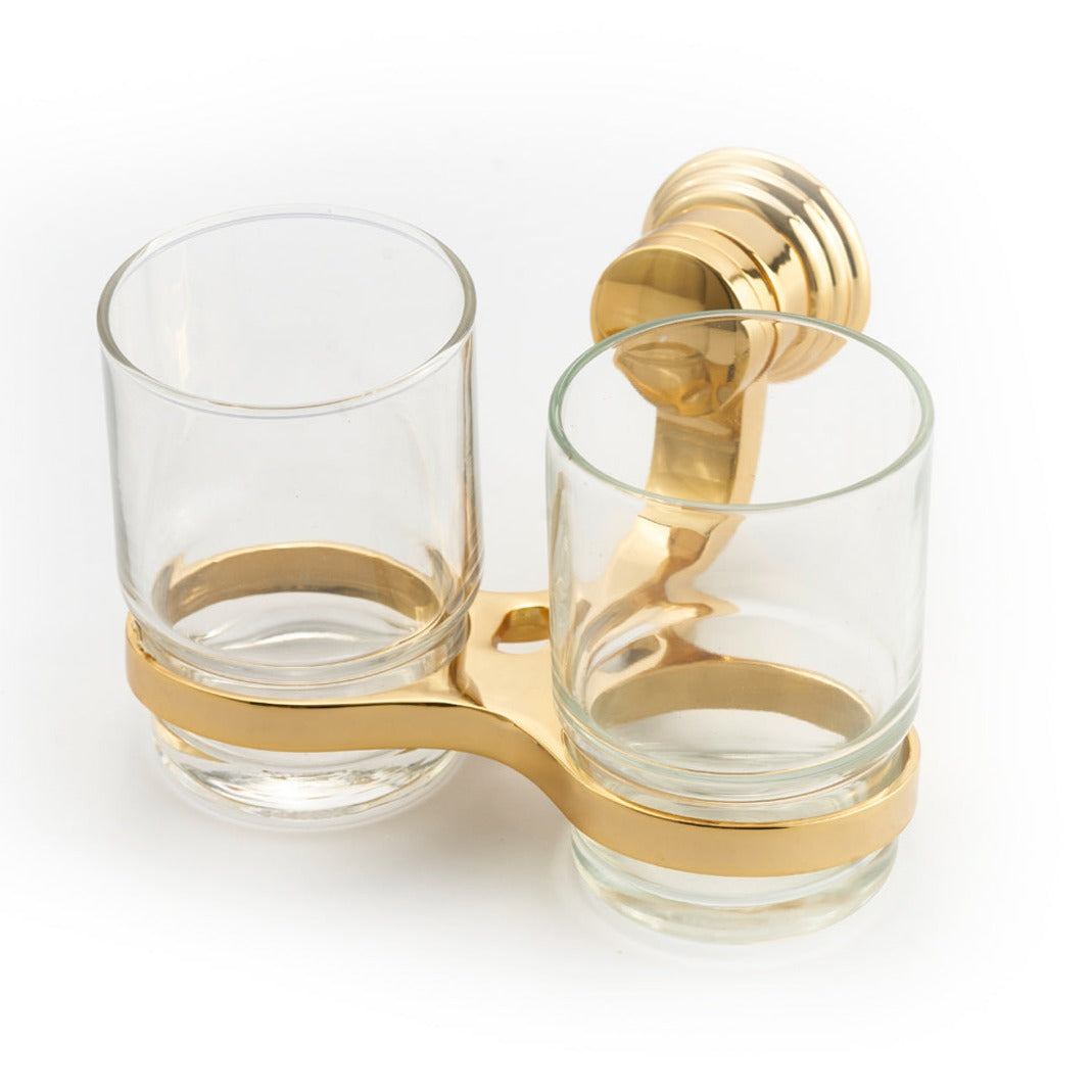 A gold-colored double cup holder made of zinc alloy, designed to hold two glasses, with a single handy lever for adjusting the spacing.