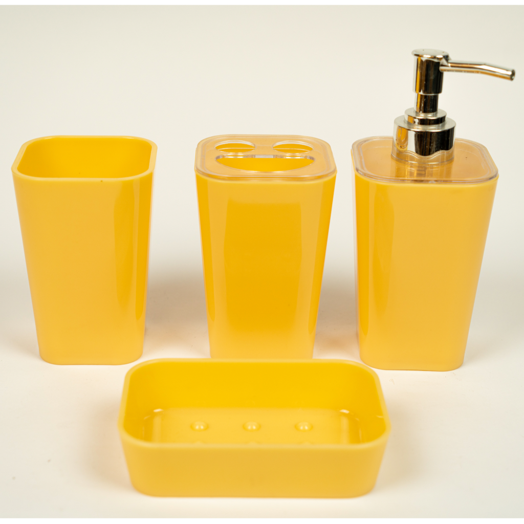 A set of yellow acrylic bathroom accessories, including a soap dispenser, toothbrush holder, tumbler, and soap dish.