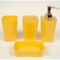A set of yellow acrylic bathroom accessories, including a soap dispenser, toothbrush holder, tumbler, and soap dish.