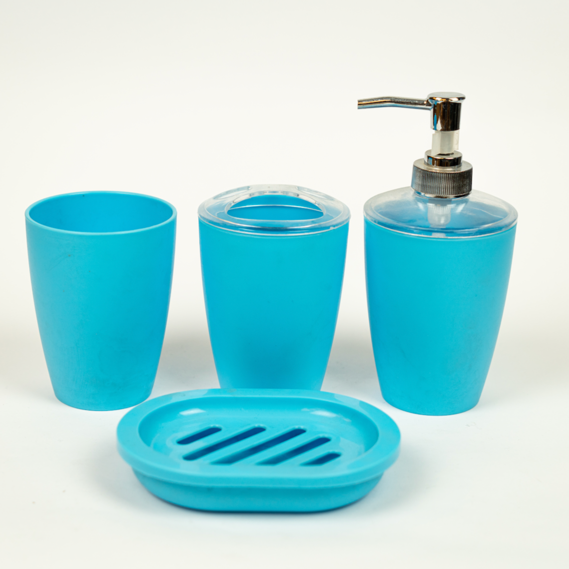 A set of blue acrylic bathroom accessories including a soap dispenser, two cups, and a soap dish.