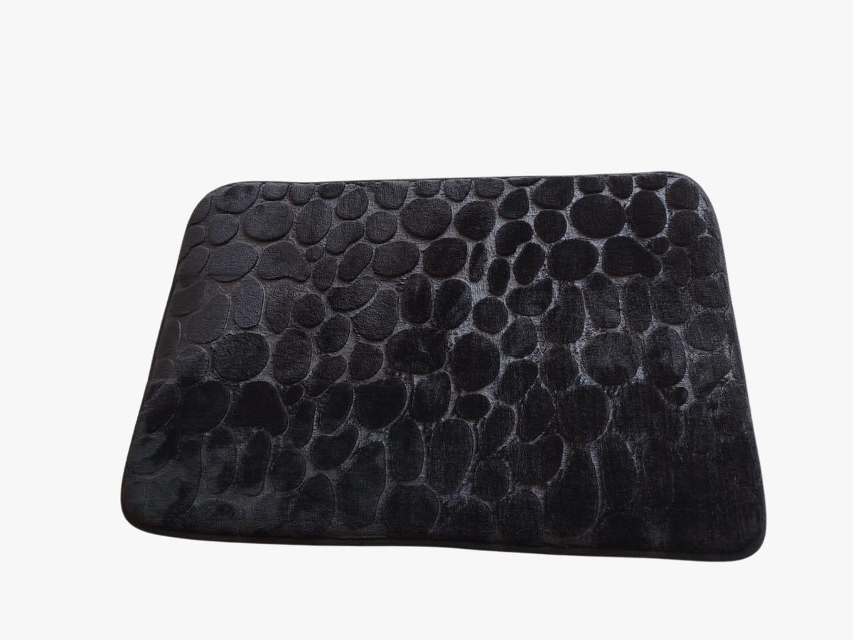 Black textured rectangular cushion on a white background