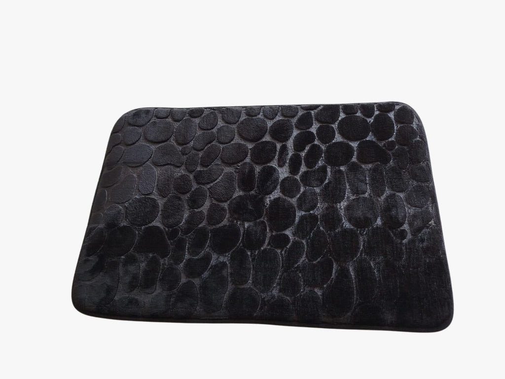 Black textured rectangular cushion on a white background
