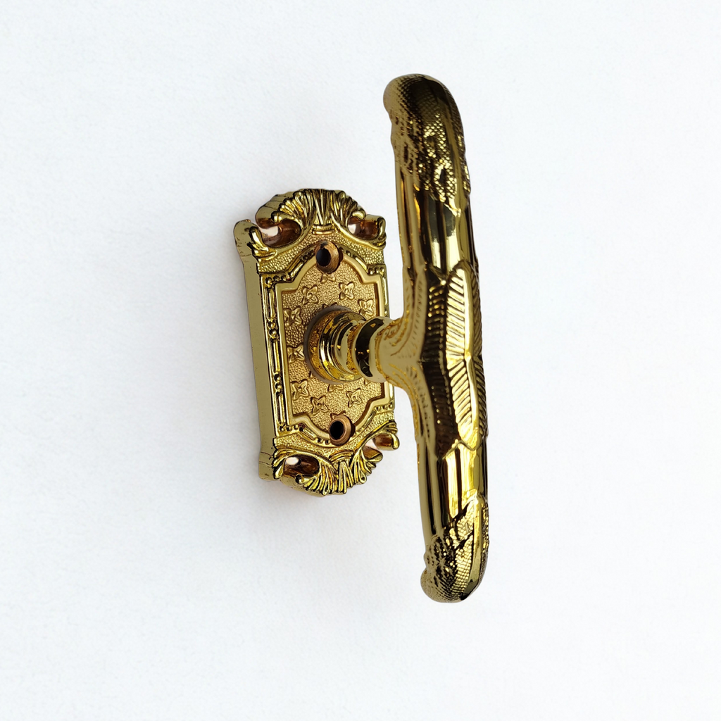 Gold window handle on a white background