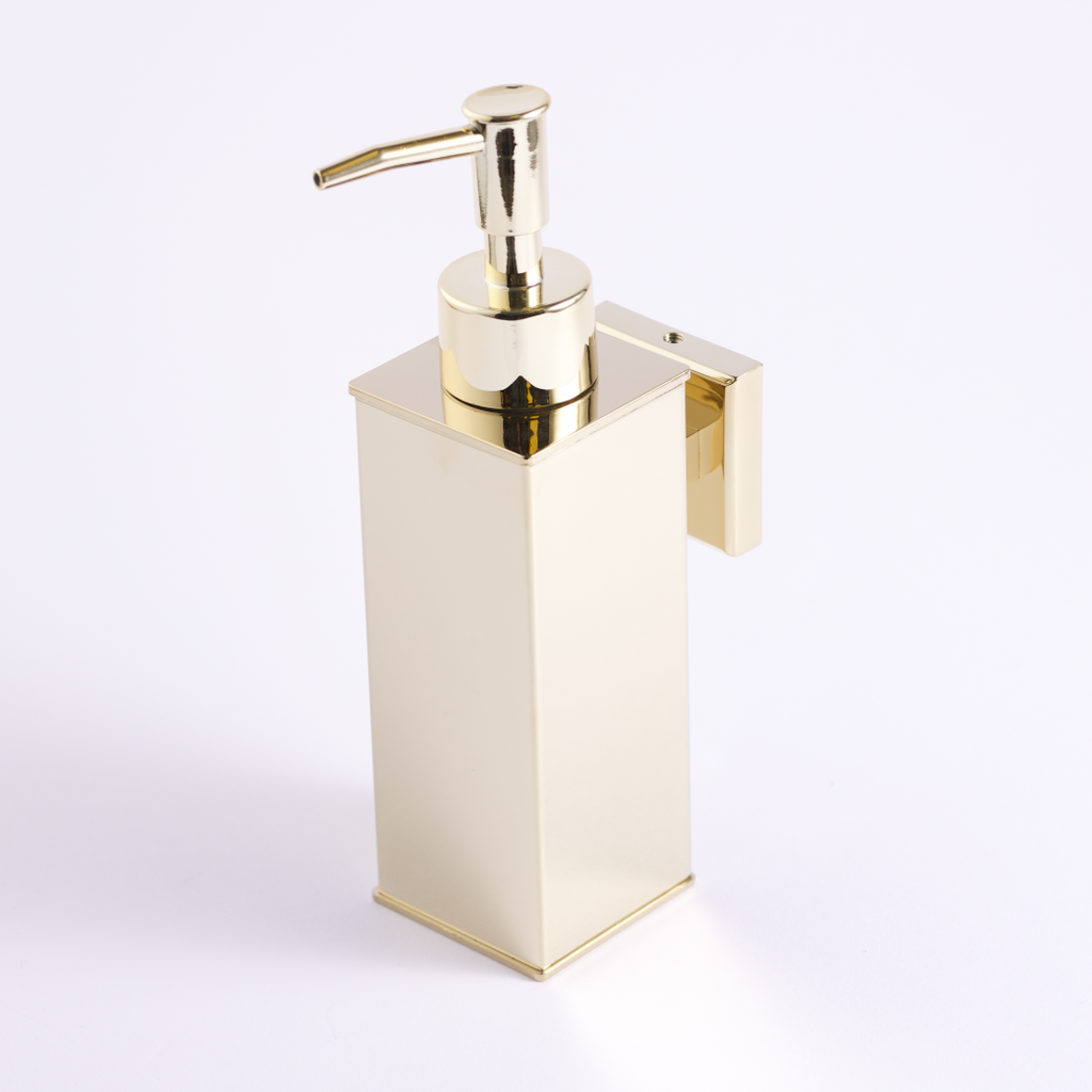 A gold stainless steel soap dispenser with a pump.
